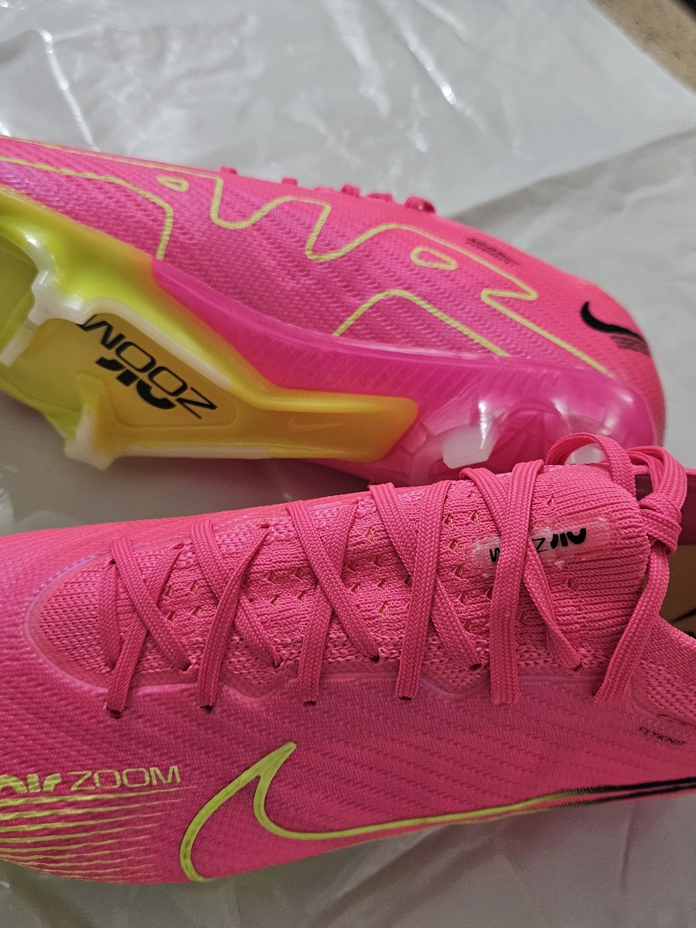 Nike Bright Pink Soccer Cleats with Neon Yellow Accents